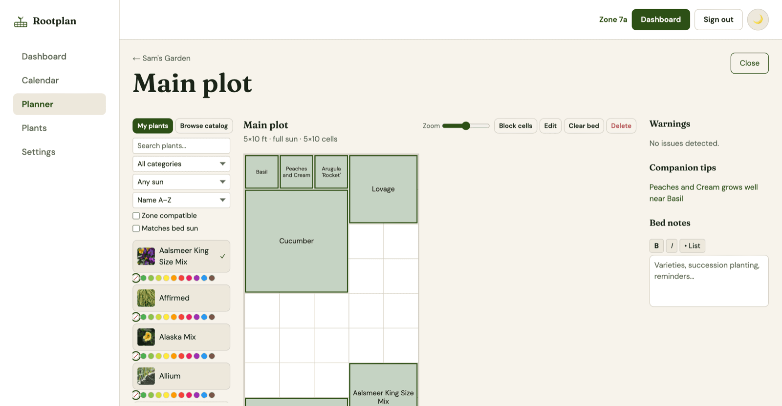 Rootplan garden planner with plants placed on a bed grid and companion tips